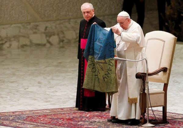 Pope Francis Condemns ‘The Massacre of Bucha’ and Holds the Ukrainian Flag Sent to Him From Bucha